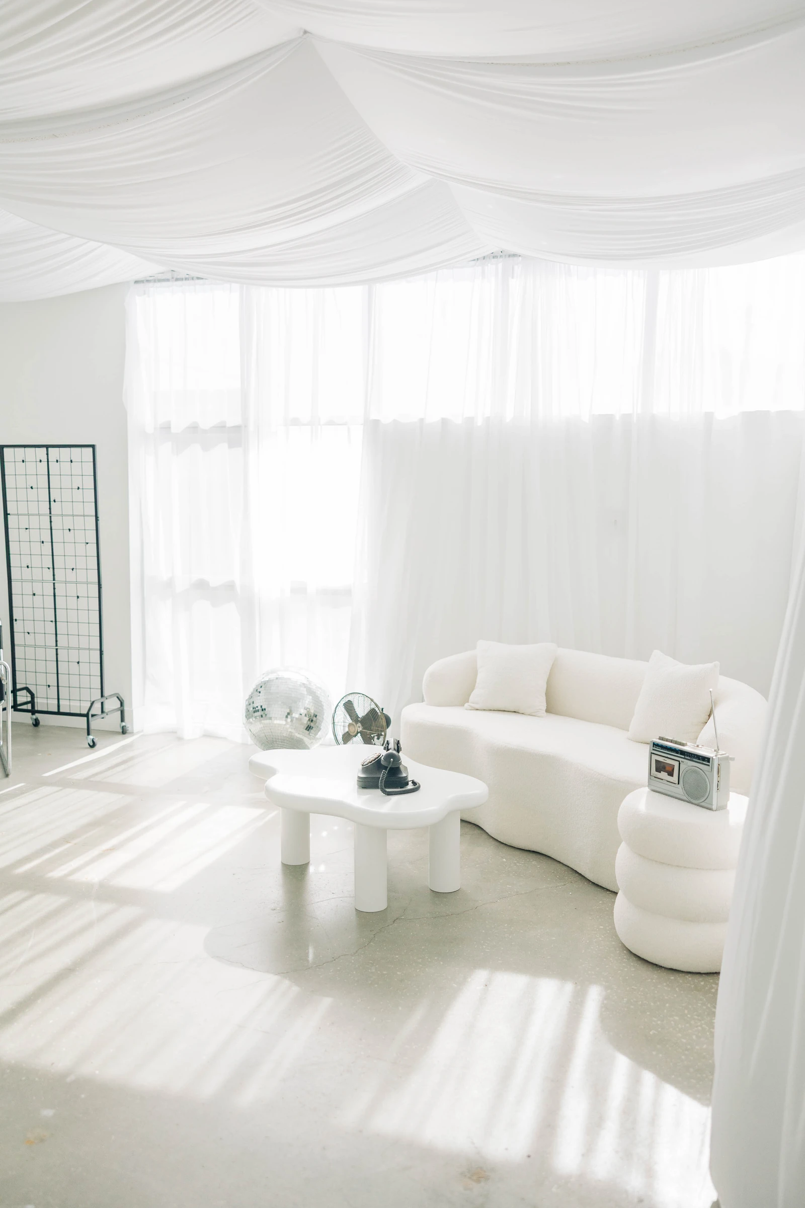 Morning sun through sheer curtains in Studio B, a fresh backdrop for content and reels